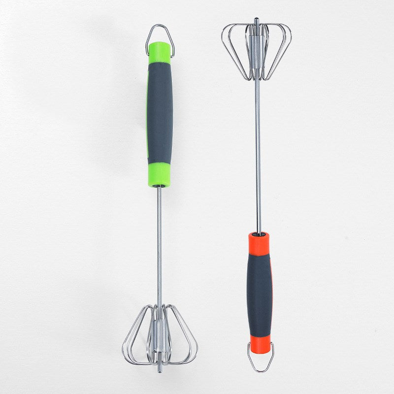 Two kitchen utensils with colorful handles on a white background