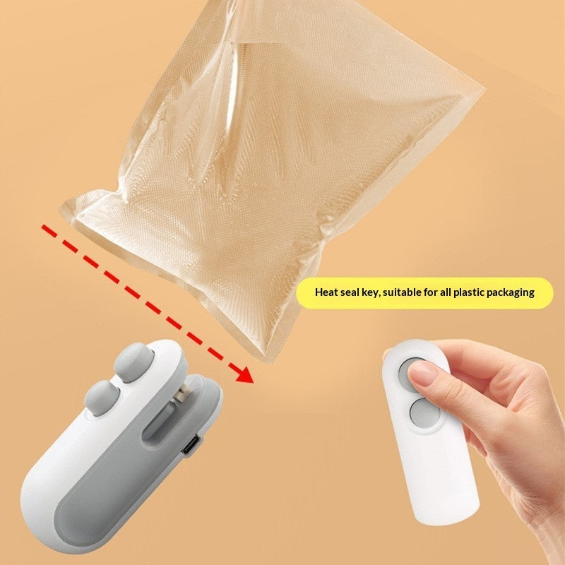 Hand holding a white device with a gray component, sealing a plastic bag on a beige background.