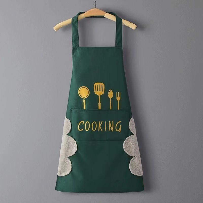 Green apron with yellow cooking utensil icons and 'COOKING' text on a gray background
