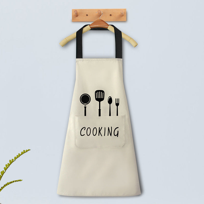 Beige apron with black accents and 'COOKING' text and utensil icons on a light gray background