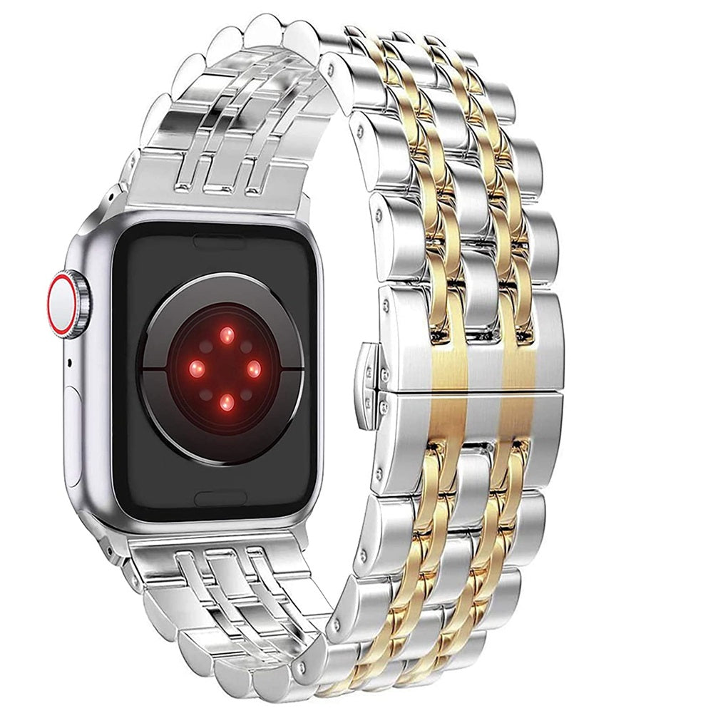 Smartwatch with silver and gold metal bands on a white background
