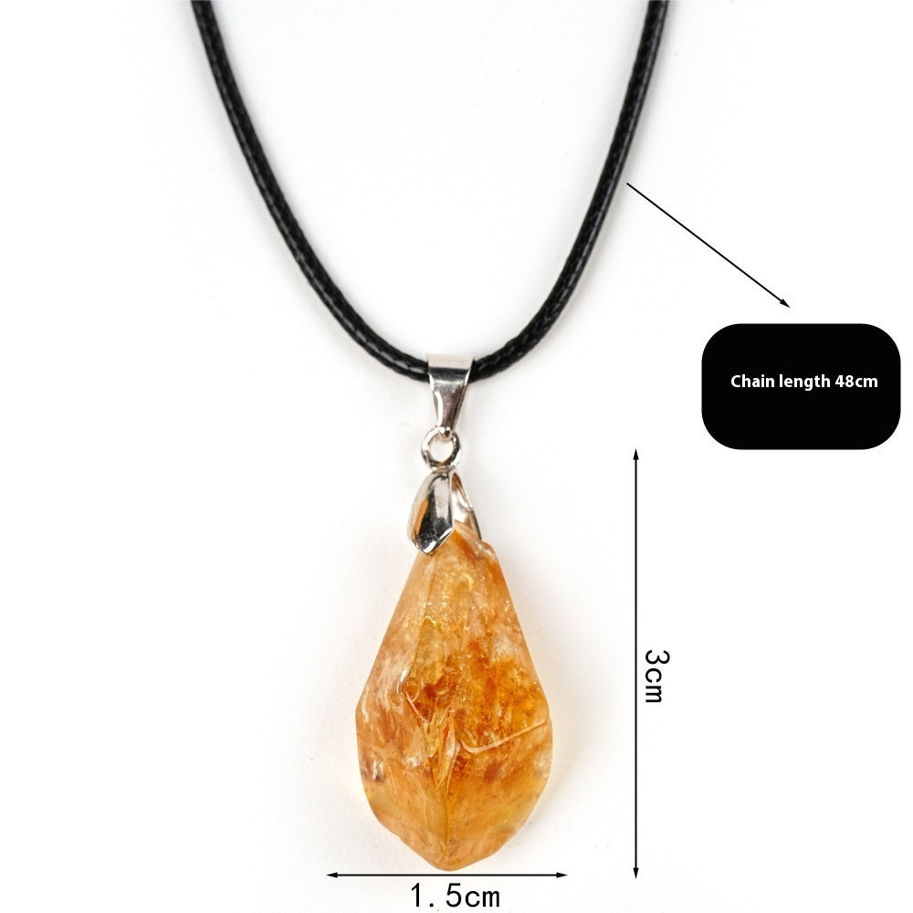 Necklace with a teardrop-shaped amber pendant on a white background