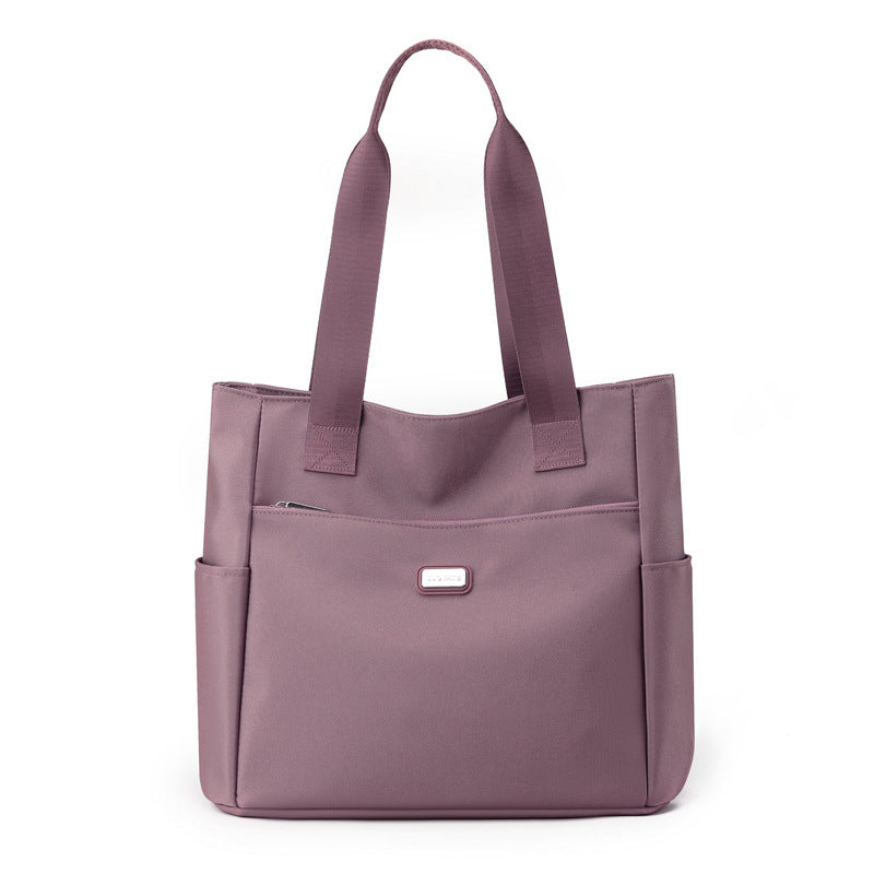 Purple tote bag on a white background