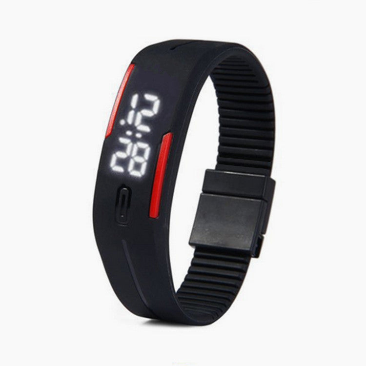 Black digital wristband with LED display on a white background