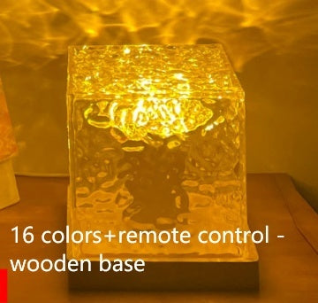 Decorative light with wooden base and 16 color options on a wooden surface.