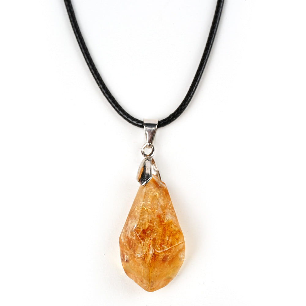Necklace with a teardrop-shaped amber pendant on a white background