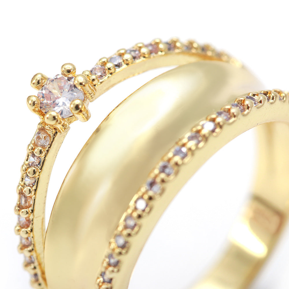Gold ring with small diamonds on a white background