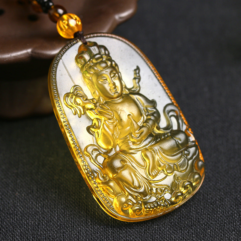 Gold pendant with a figure on a dark background