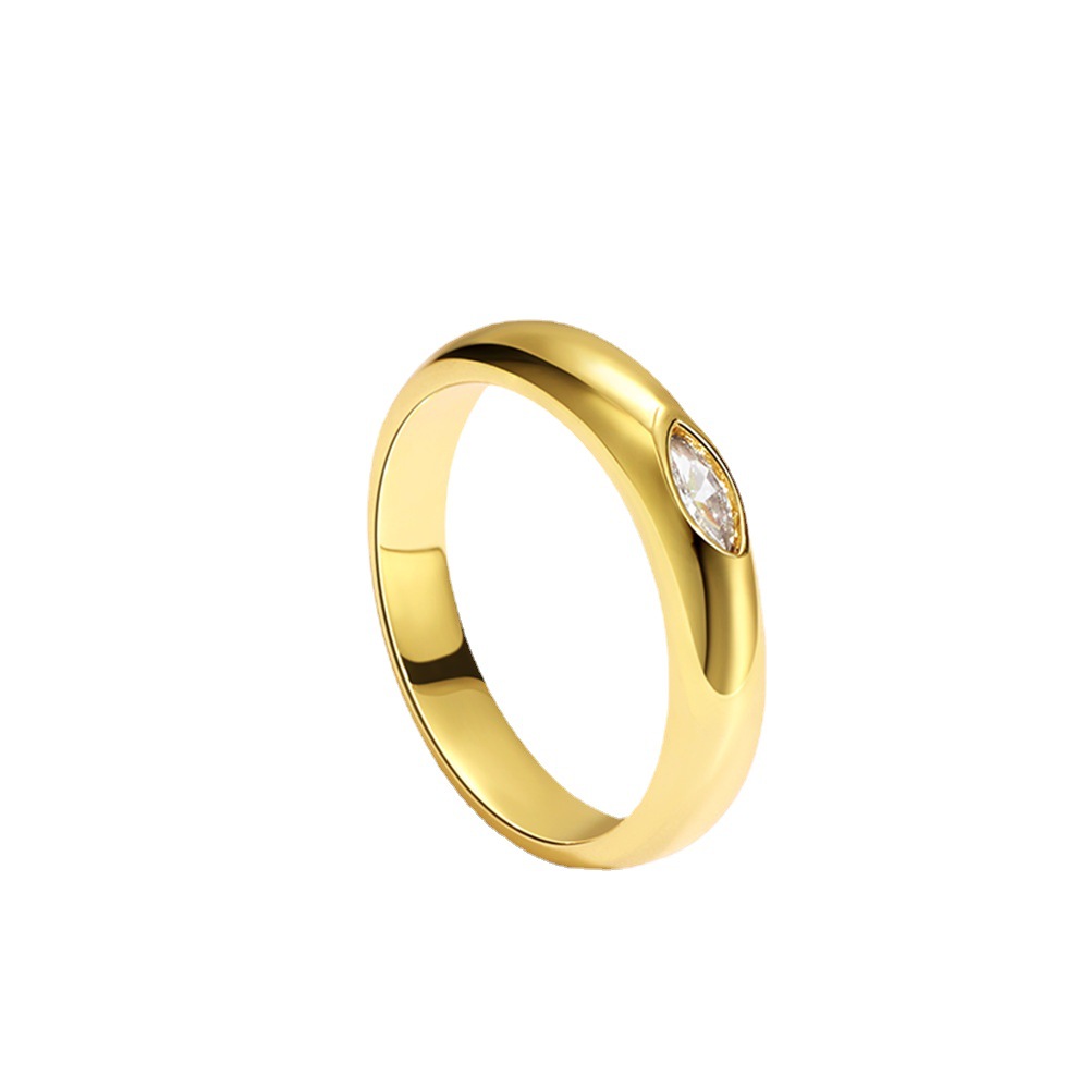 Gold ring with a diamond on a white background