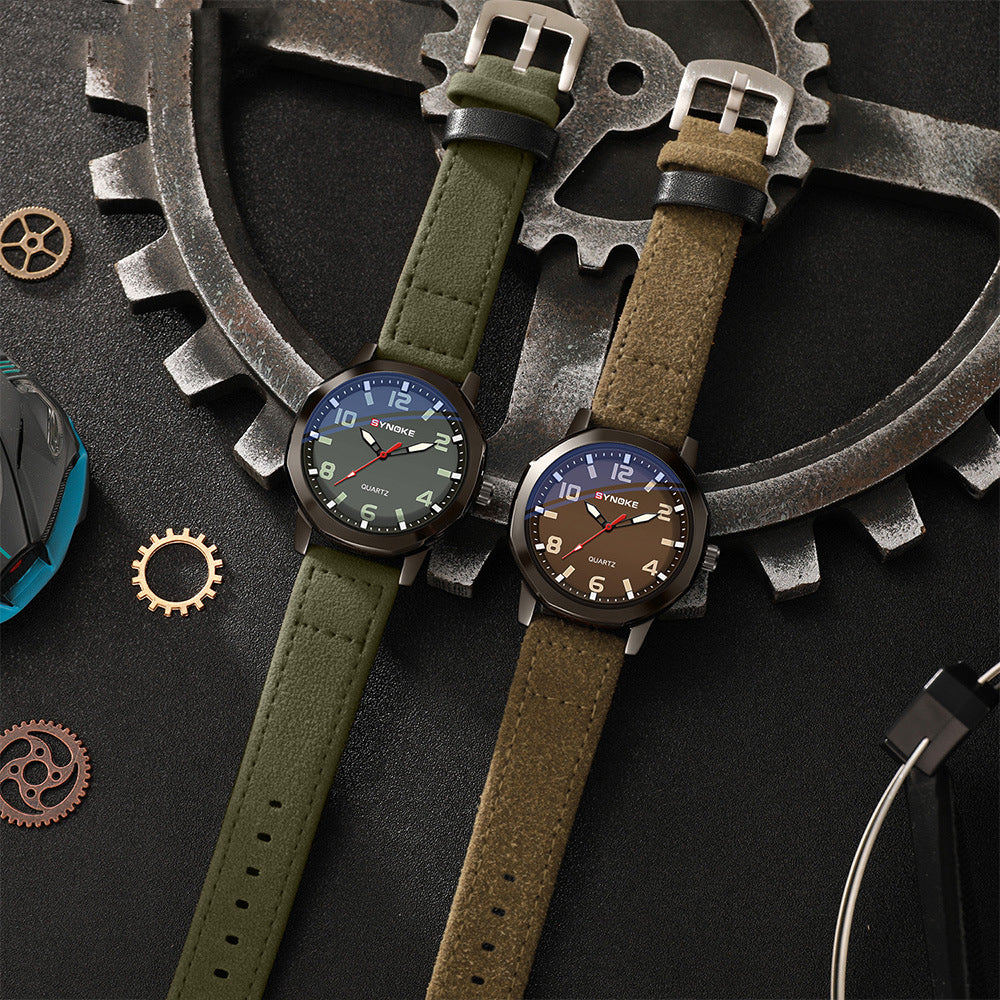 Two watches with green and brown straps on a mechanical gear background
