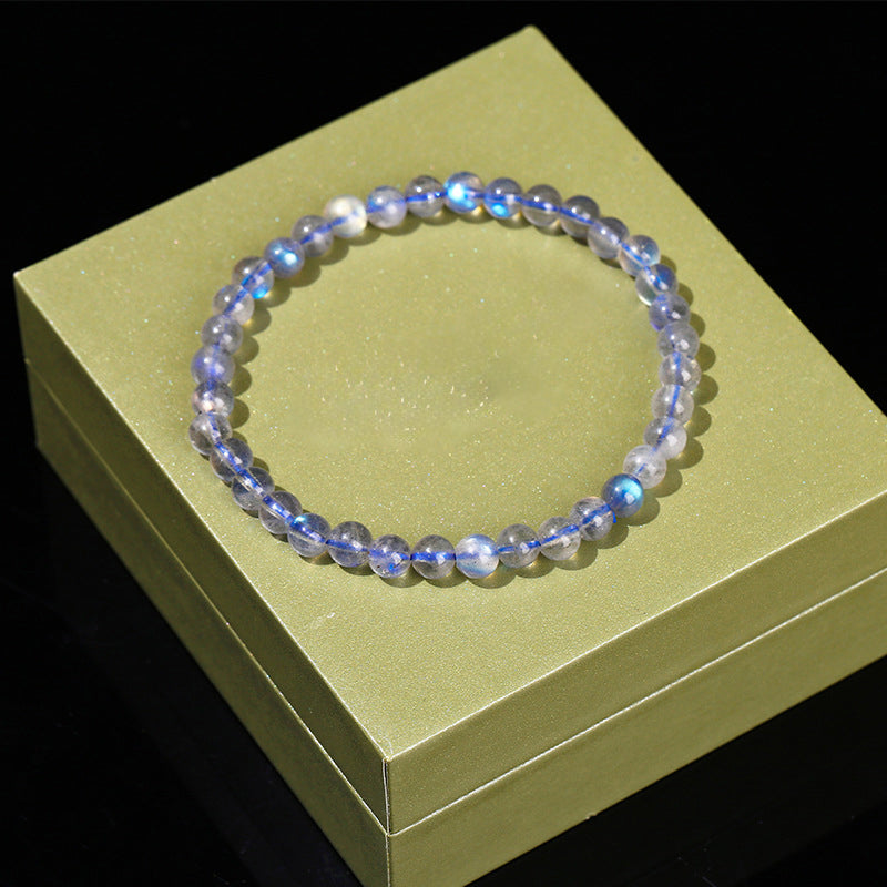 Beaded bracelet on a green box with a black background
