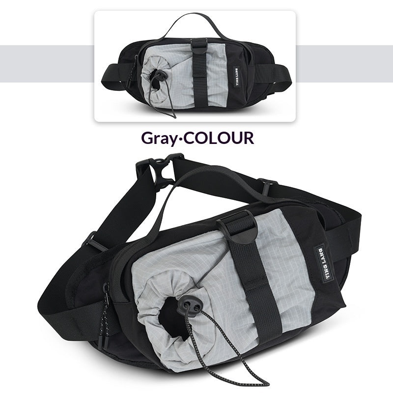 Black and gray waist bag with reflective material on a white background