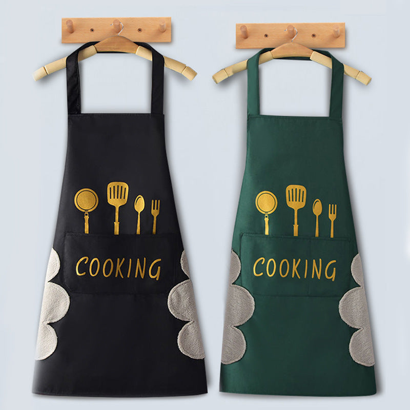 Two aprons, one black and one green, with cooking utensil designs and 'COOKING' text on a light gray background.