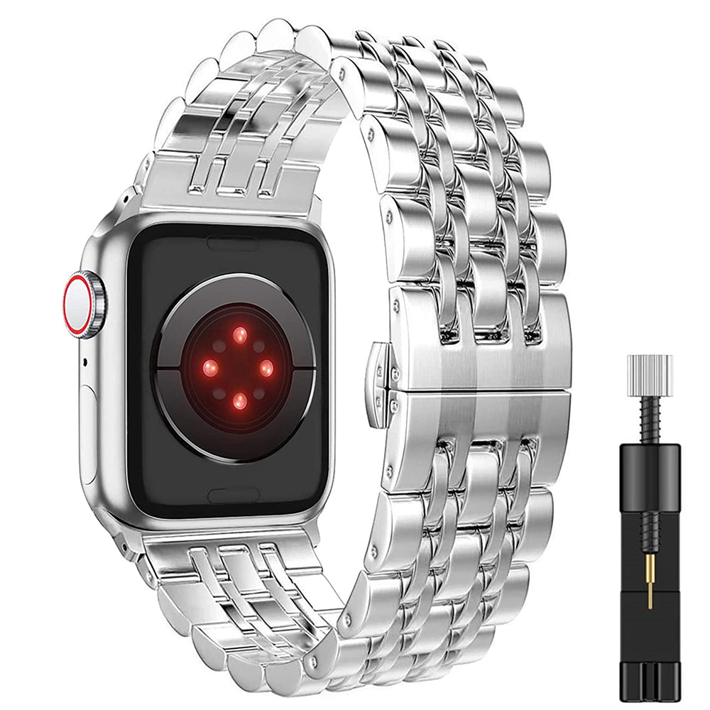 Silver metal watch band with tool on a white background