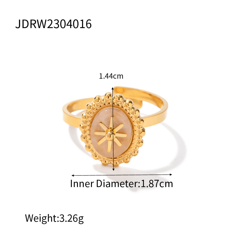 Gold ring with measurements on a white background
