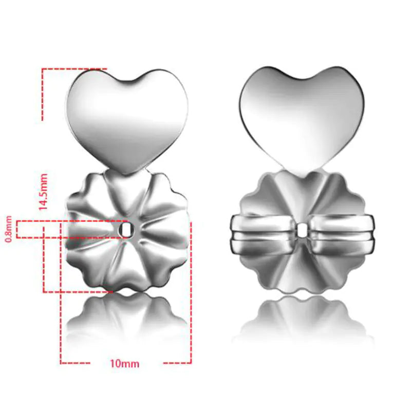 Heart-shaped silver earrings with detailed design on a white background