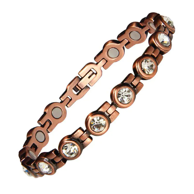 Copper chain bracelet with embedded crystals on a white background