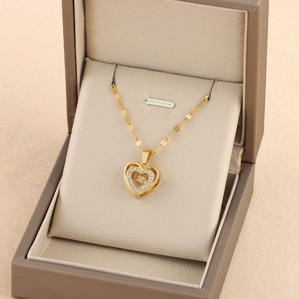 Gold heart-shaped pendant necklace in a jewelry box