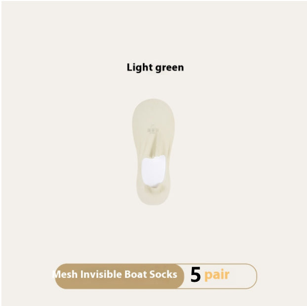 Light green mesh invisible boat socks on a beige background