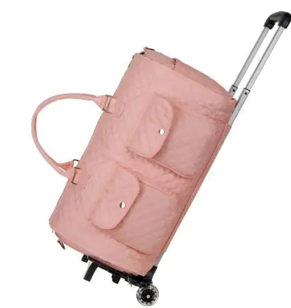 Pink rolling suitcase on a white background