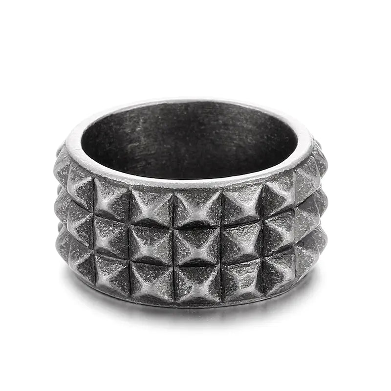 Silver studded ring on a white background