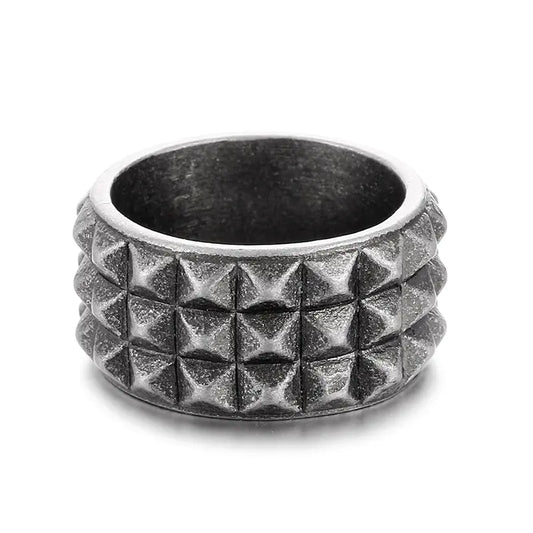 Silver studded ring on a white background