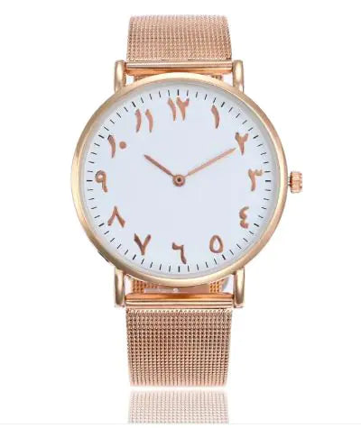 Rose gold watch with a white face on a white background