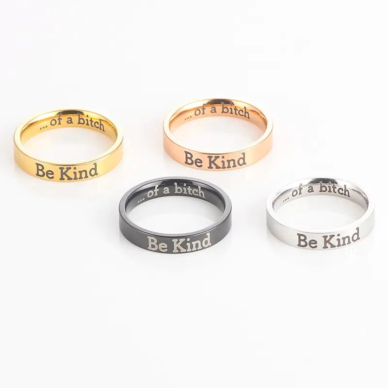Four rings with different color options and text on a white background