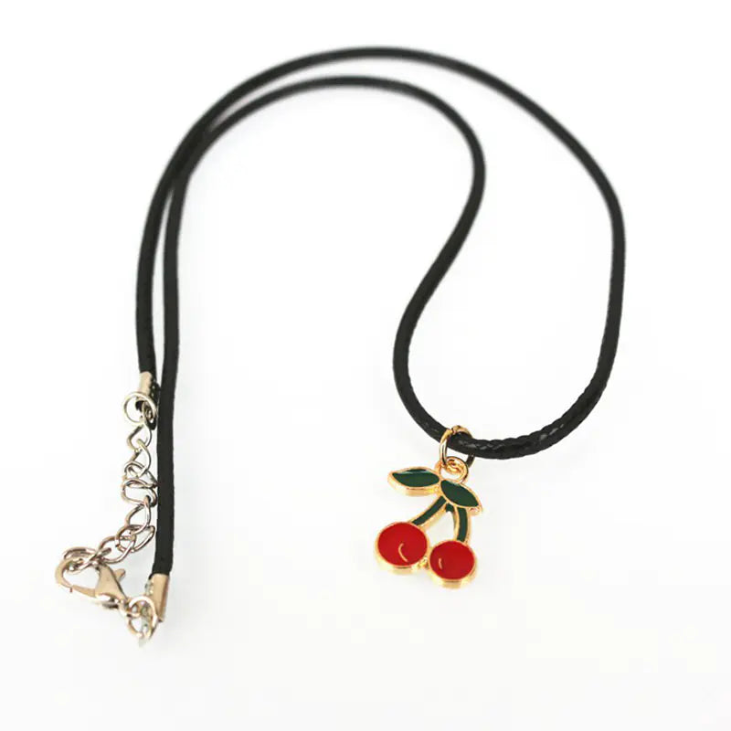 Necklace with cherry charm on a white background