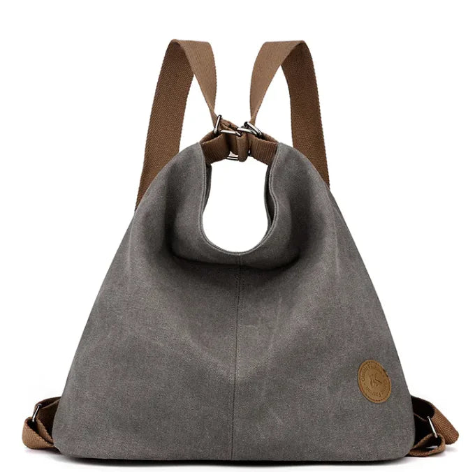 Gray handbag with brown straps on a white background