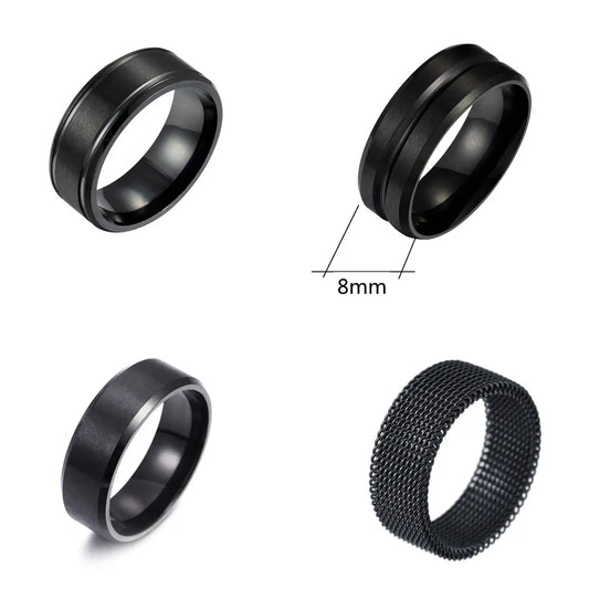 Four black rings with different designs on a white background