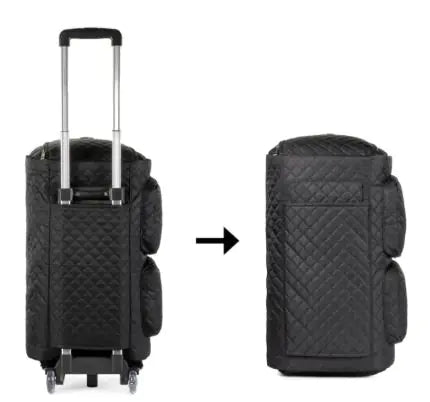 Black quilted suitcase with wheels on a white background
